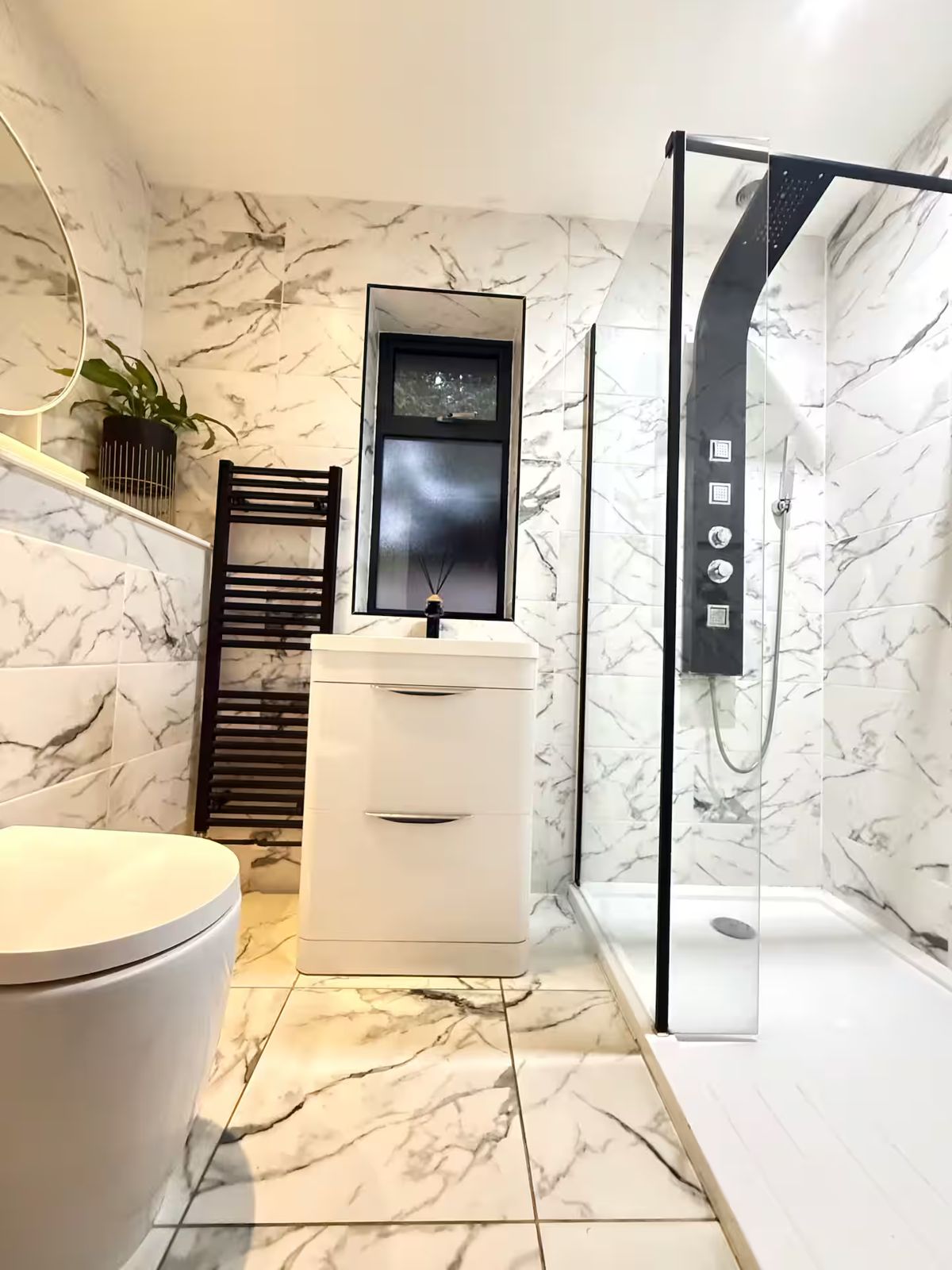 Marble-effect shower room with a walk-in shower